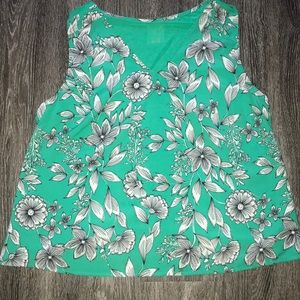 Green and white floral blouse